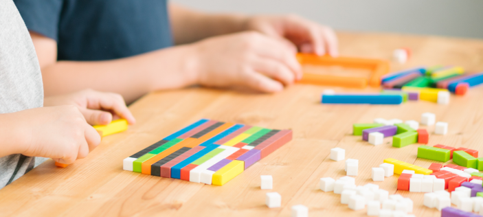 Students using Cuisenaire Rods on a table