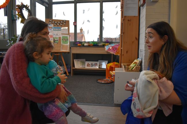 Child and carer in classroom