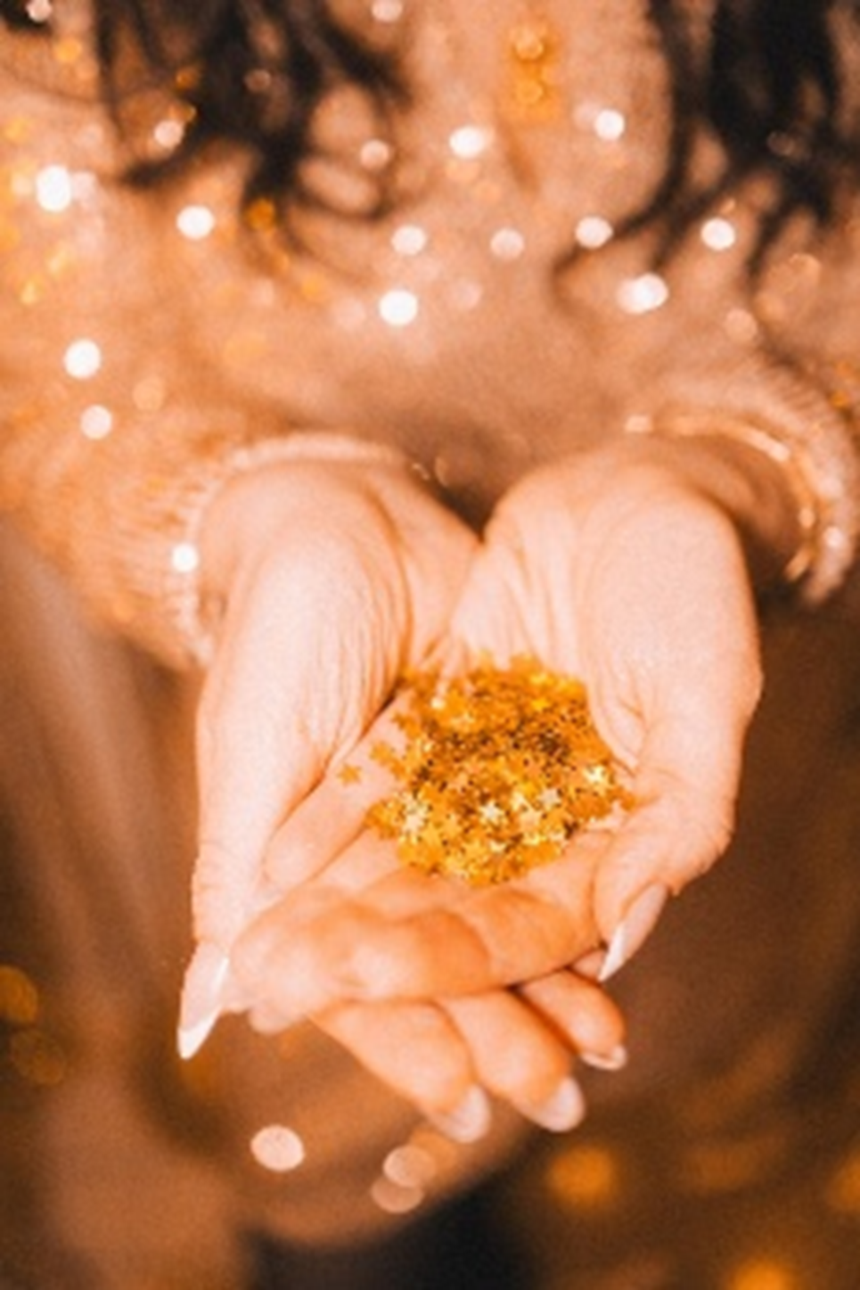 Gold glitter in hands
