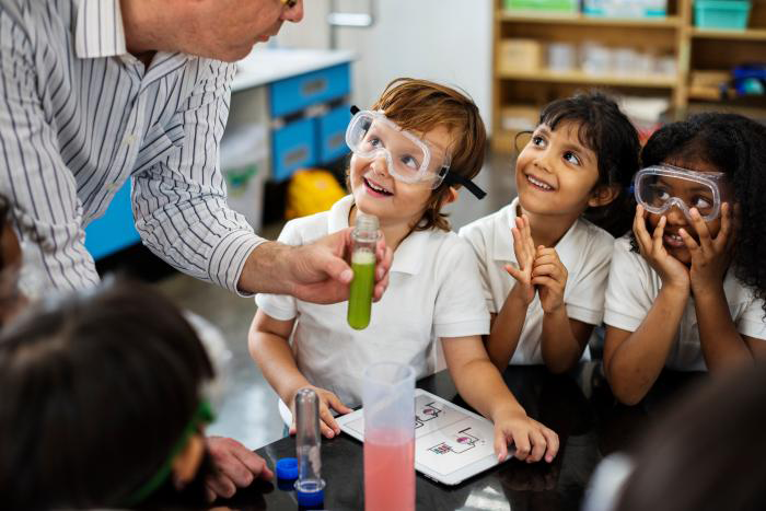 Happy children in science class