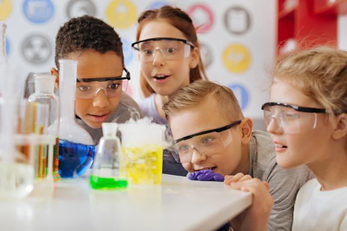 Happy children in science class