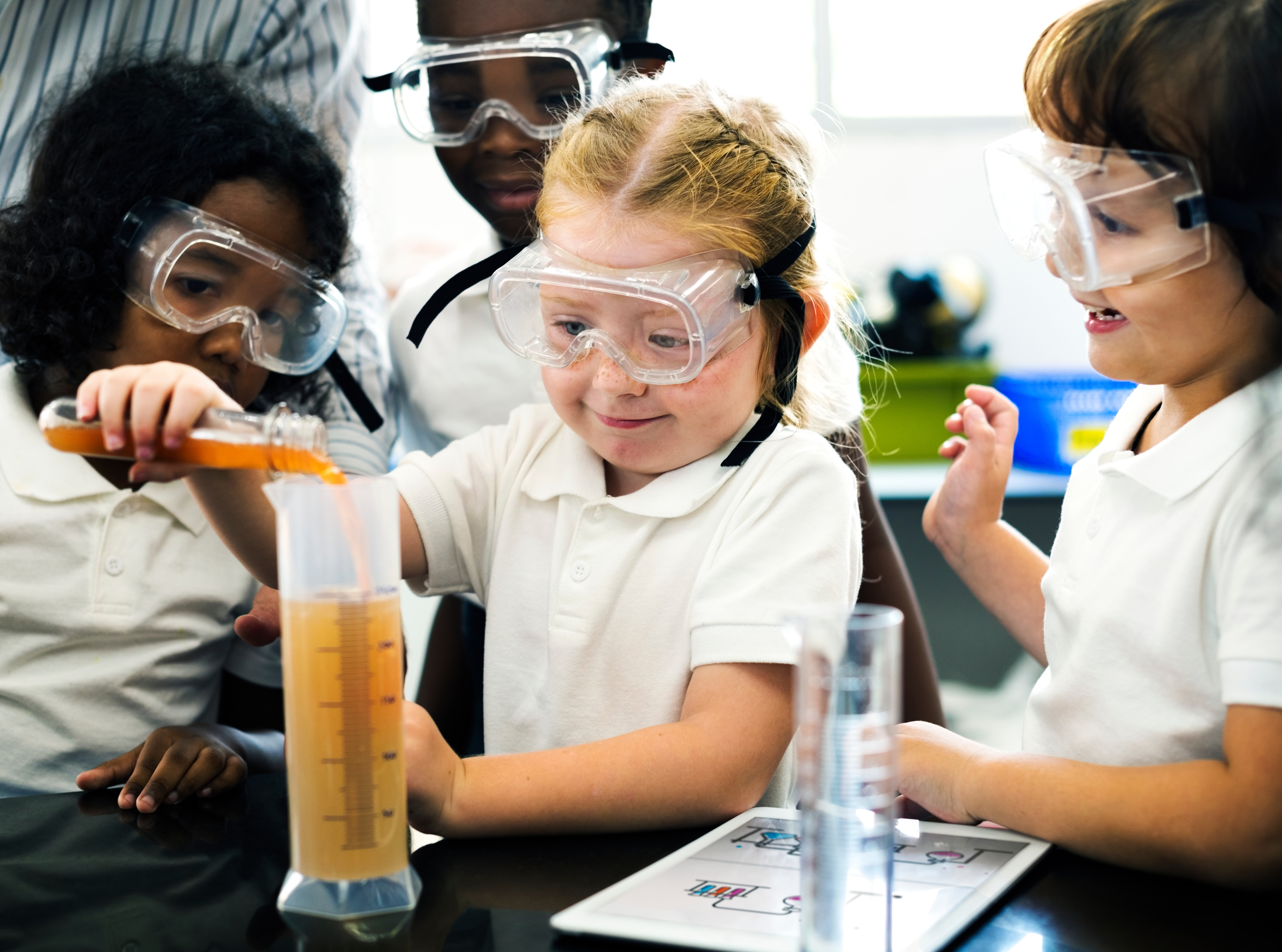 Primary age students conducting science