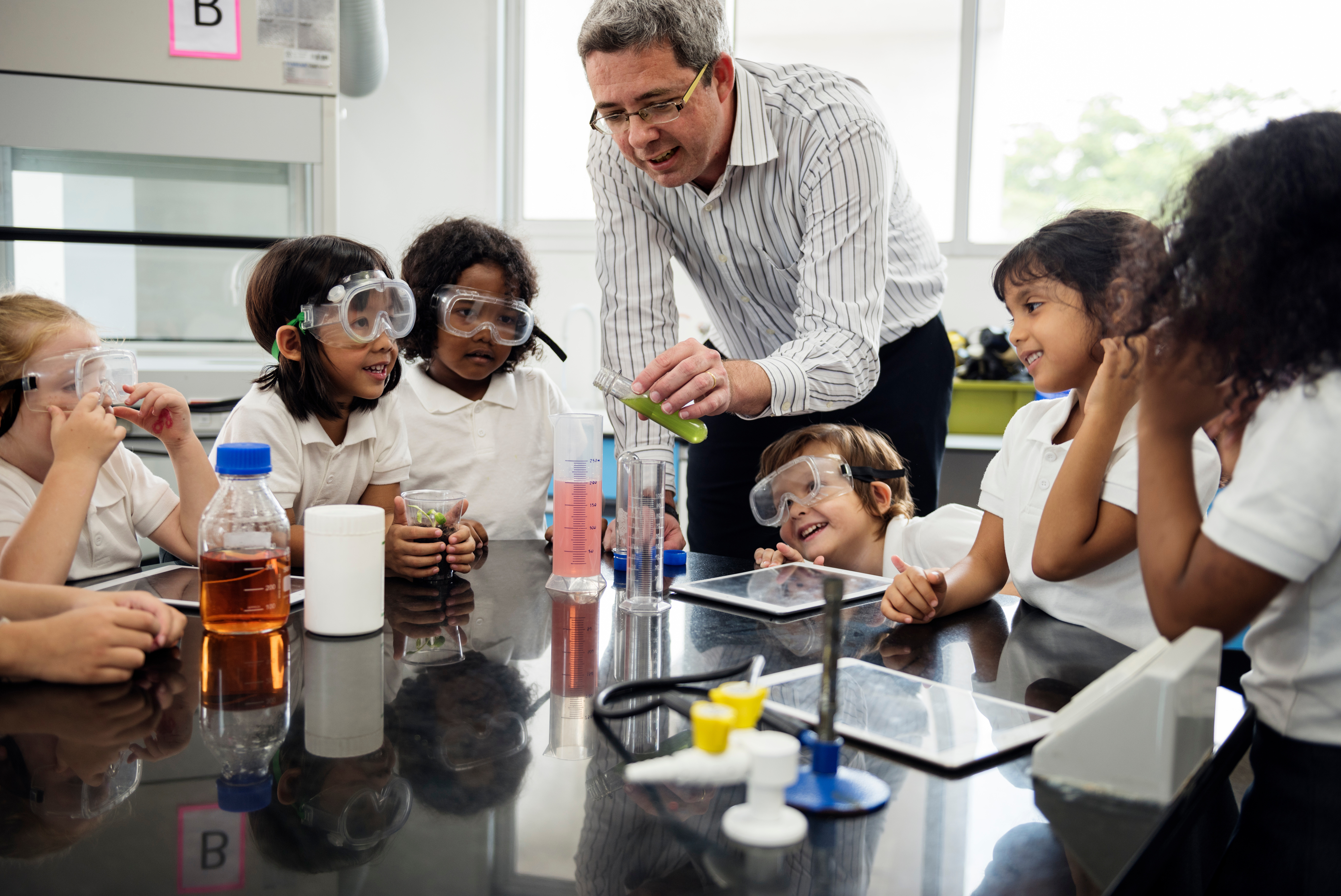 Primary age students conducting science