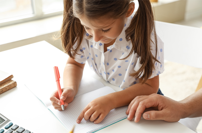 Little girl practicing handwriting