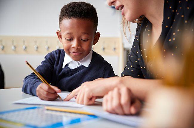 Little boy practicing handwriting