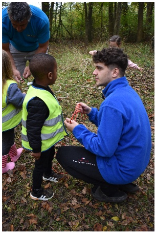 Child in high vis jacket with adult