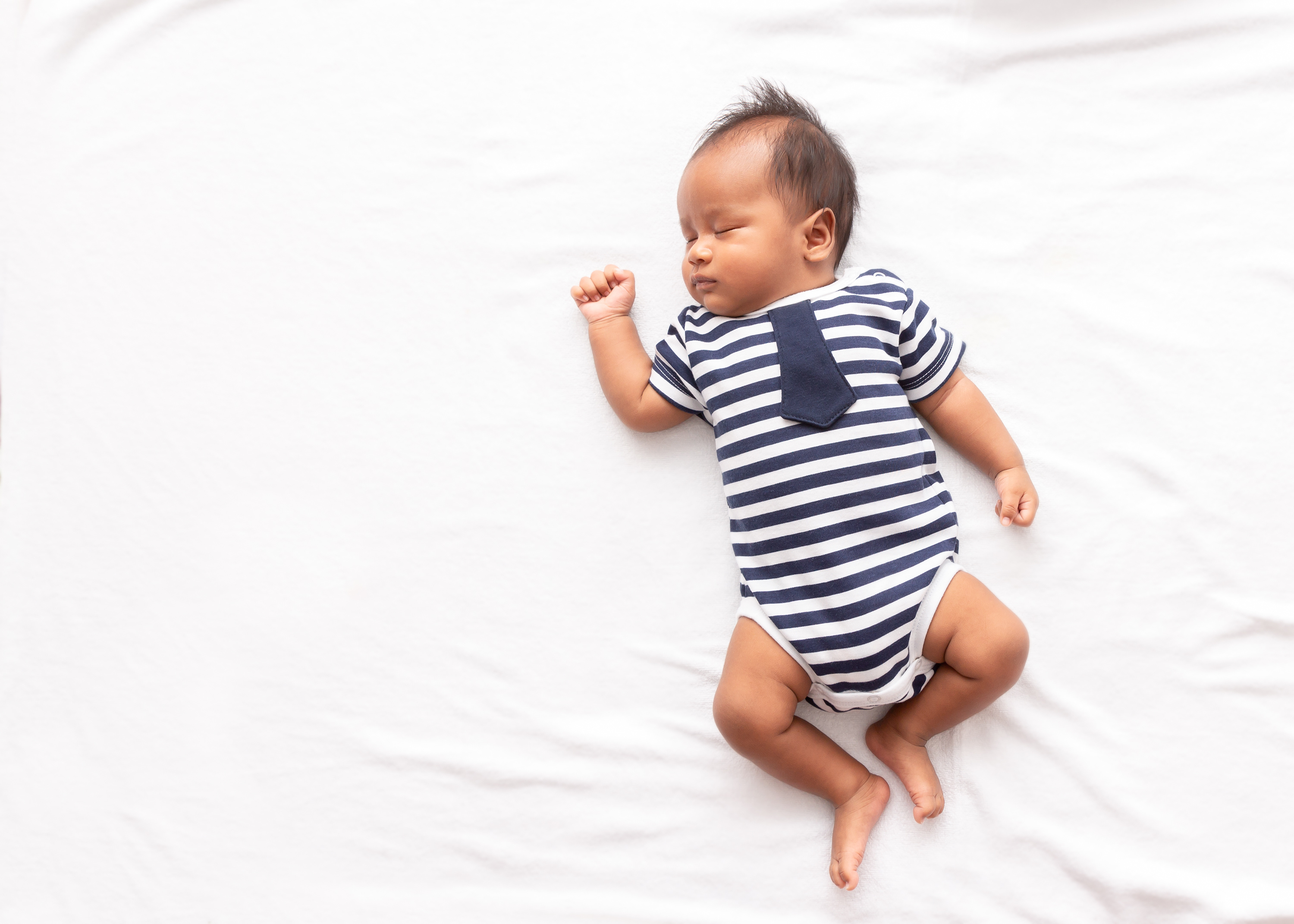 Child sleeping on back