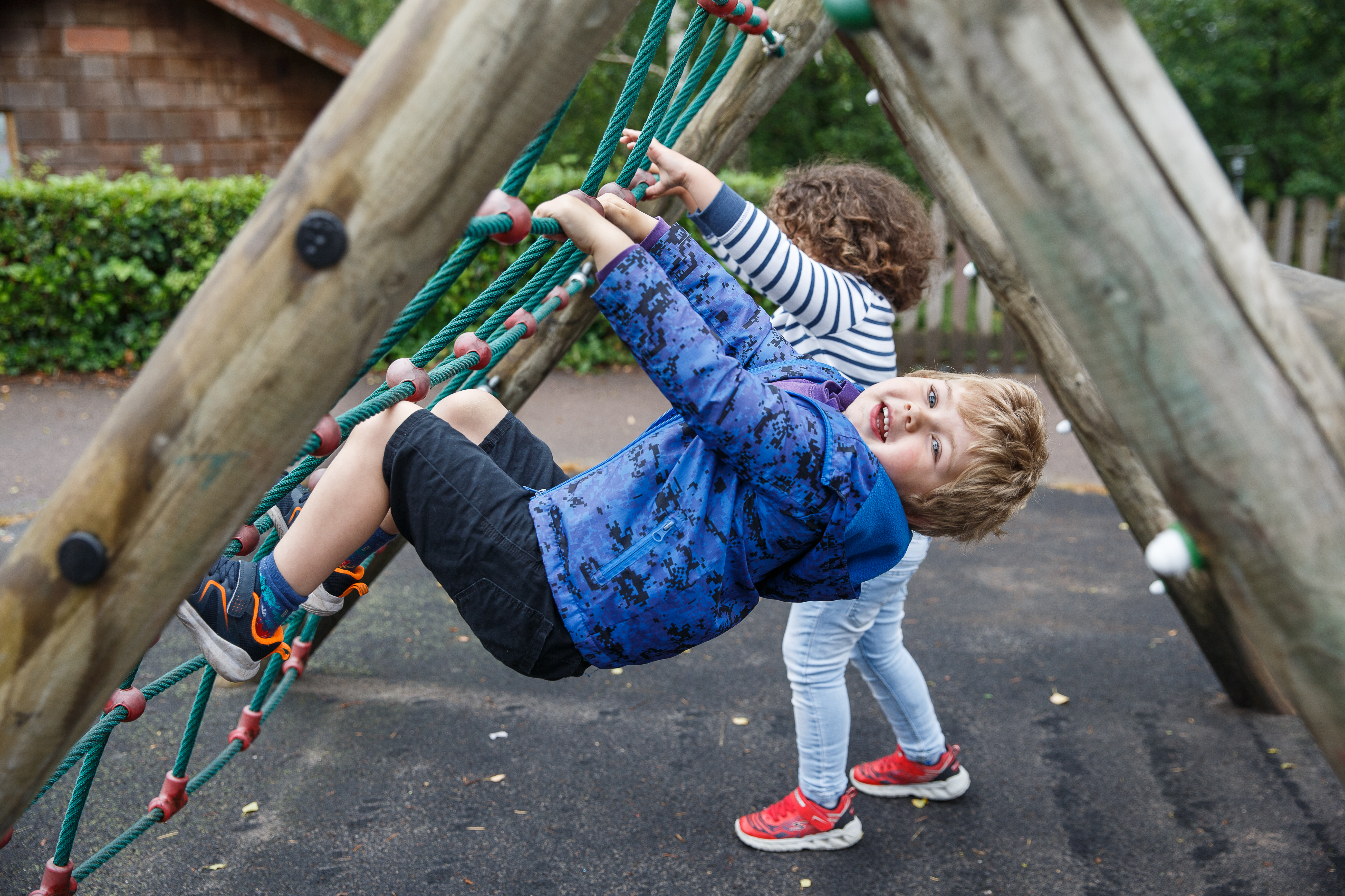 Child playing on climbing frame