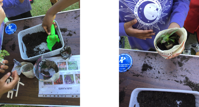 Children potting small plants