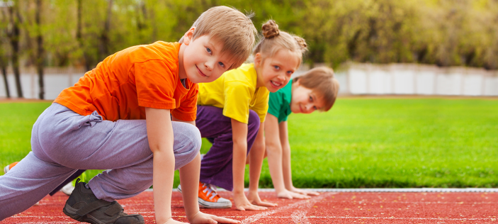 children at a start line for running