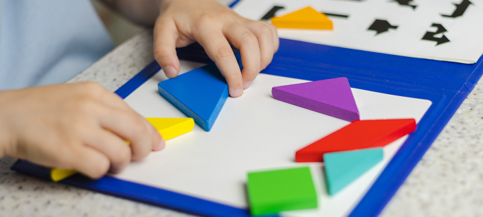 child playing with maths toys