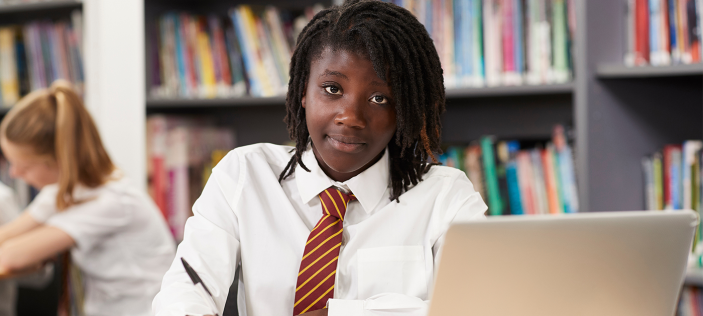 Pupil sat in front of books