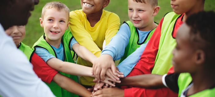 Children crossing hands