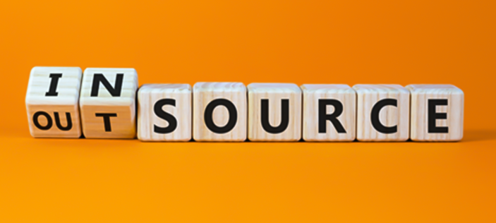 In/outsource text on yellow background 