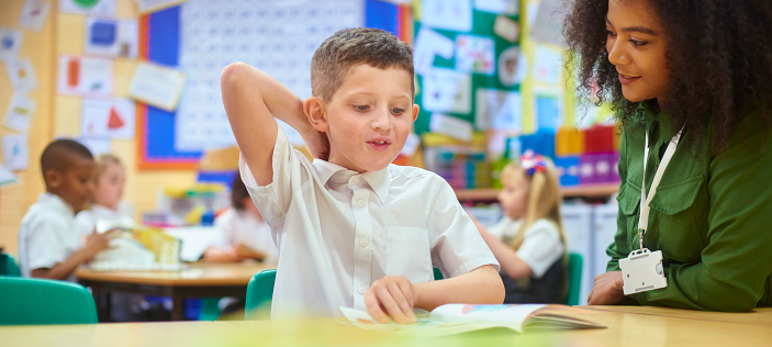 woman with boy in classroom