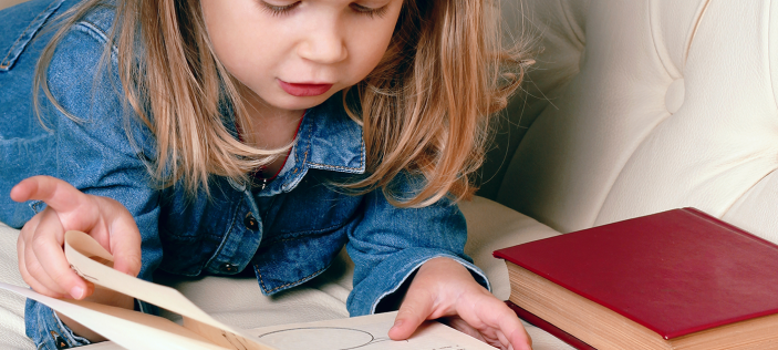 Young girl reading a book