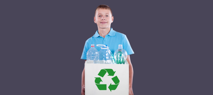 Boy holding recycling box