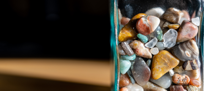 Collection of mixed stones in a glass