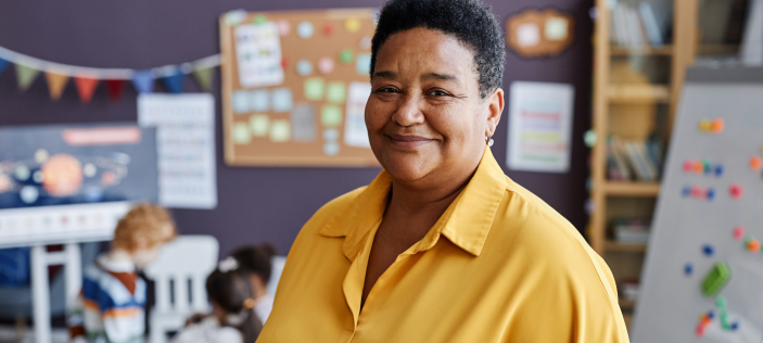 Adult in Early Years class, wearing yellow