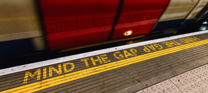 "Mind the gap" text on train station platform 