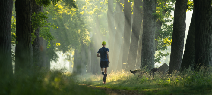 Man running in woods