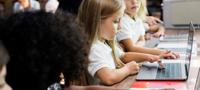 young children using a chromebook