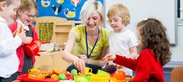 early years teacher with children