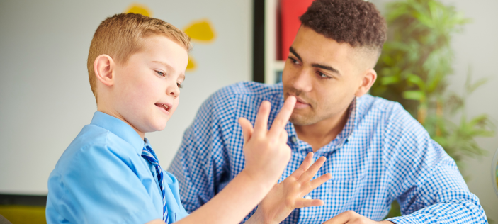 boy using fingers to do maths