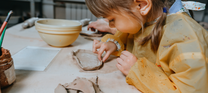 Child playing with clay