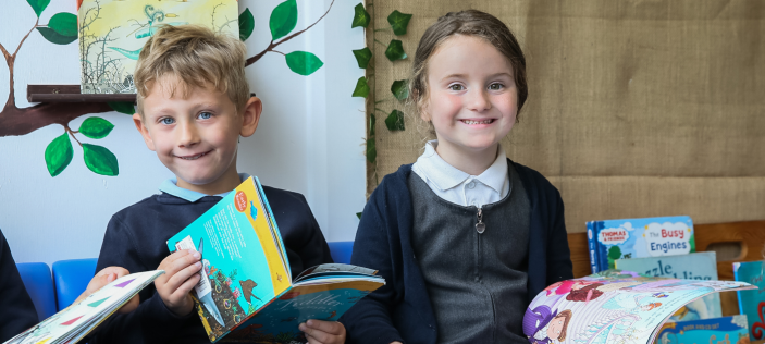 Happy looking children with books