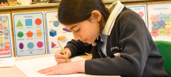 Child writing on paper