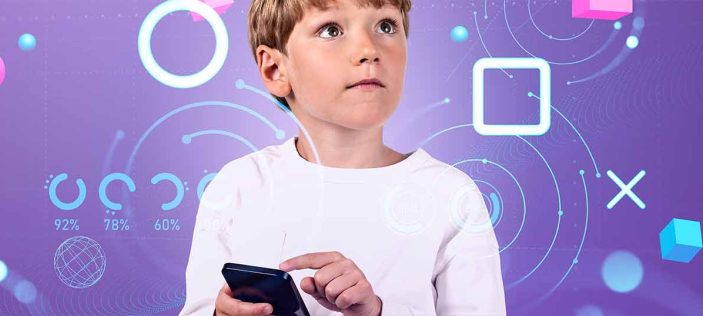 Child holding his finger near to a phone on a purple background