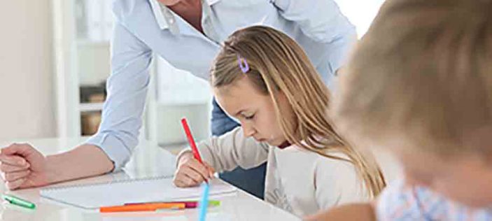 Adult tutor with child