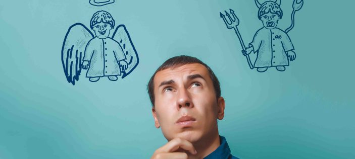 Man thinking with angel on one side of his head and devil on the other