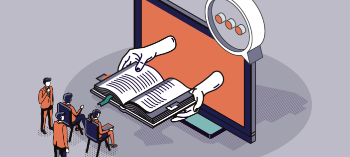 hands producing a book from an orange screen