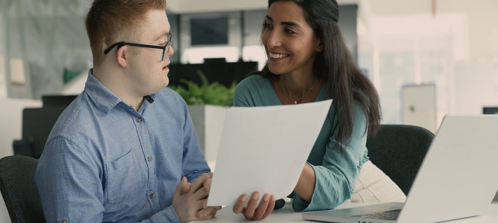 SEND teaching assistant with young adult 