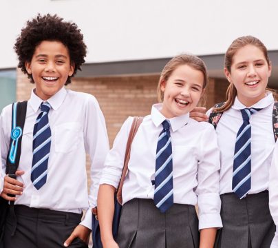 a row of secondary aged children in uniform