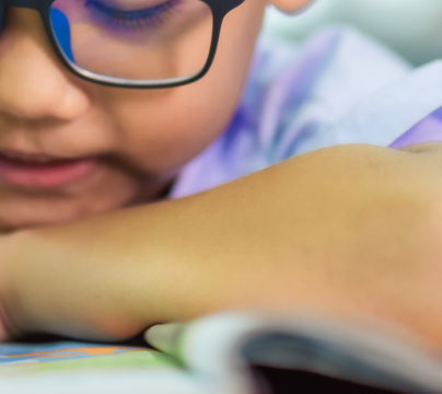 boy with glasses reading