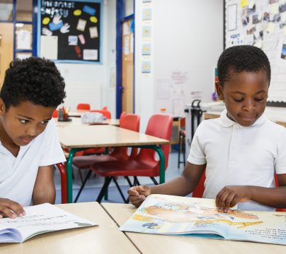 2 boys of colour reading
