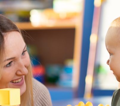 female practitioner with early years child