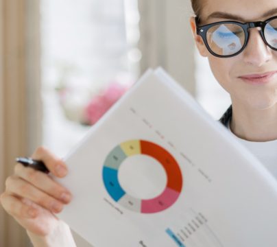 woman looking at financial graphs