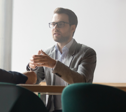 man sitting across the table from another person