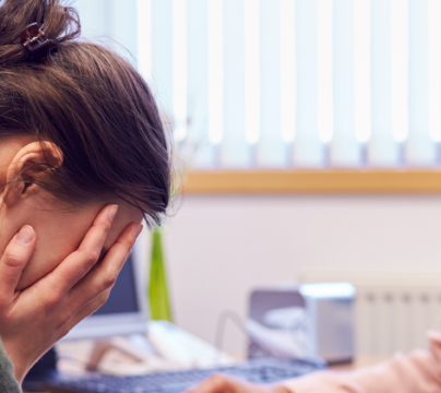 headteacher with upset colleague