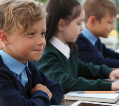 children in classroom on computers