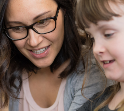 teacher with girl with headphones on