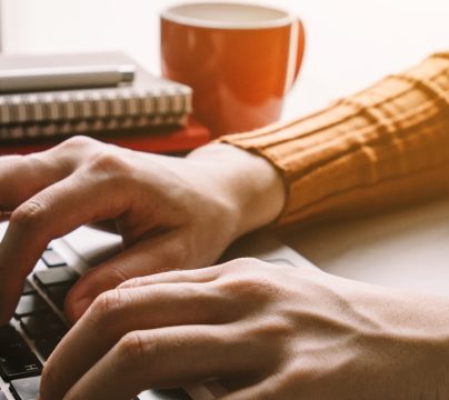 woman typing on laptop