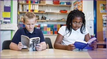 girl and a boy reading