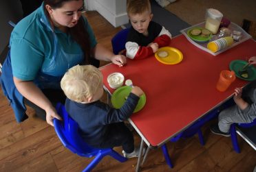Children being supervised at meal time