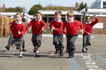 Children running in a school playground