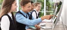 secondary pupils looking at computers